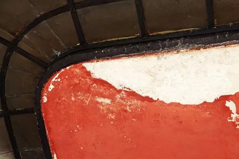 Part of worn underside to old balcony in iron and concrete Stock Photos