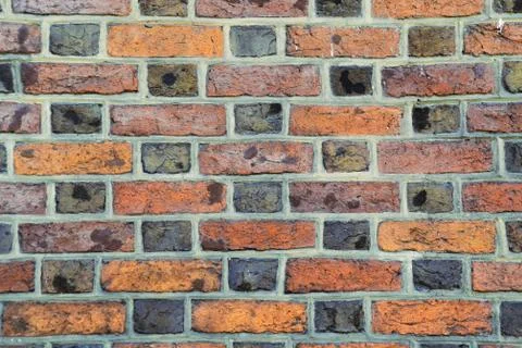 Parti-colored brick wall Stock Photos