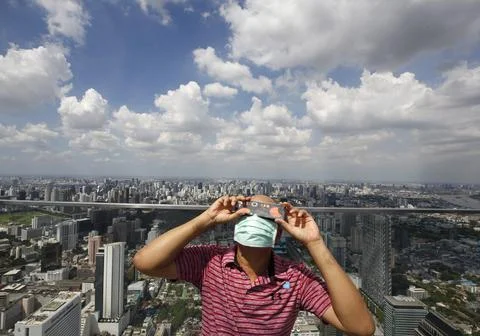 Partial annular solar eclipse seen from in Thailand, Bangkok - 21 Jun 2020 Stock Photos