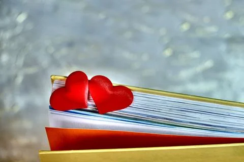 Partial blur Two red hearts on the pages of a book, Stock Photos