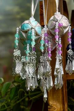 Partial close-up of silver fish pendant brocade hydrangea hanging ornament Stock Photos