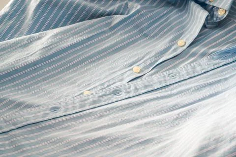 Partial closeup of a light blue striped shirt Foto stock