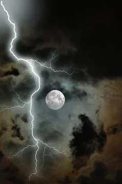 Partial cloud covered moon on a stormy night in florida Stock Photos
