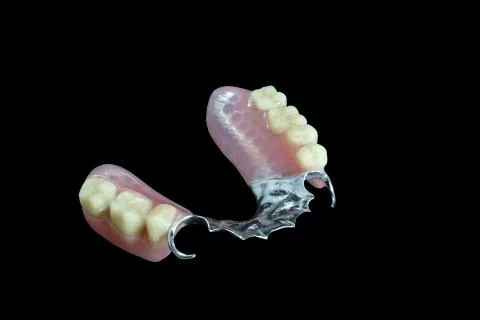 Partial denture on black background Stock Photos