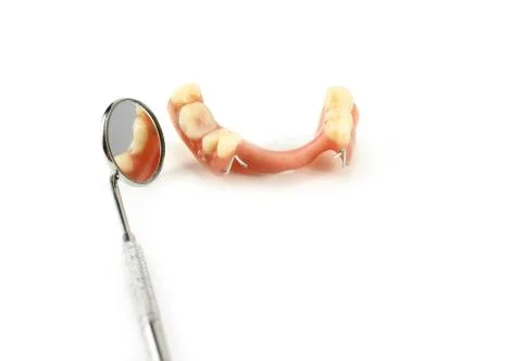 Partial denture reflected in dental mirror Stock Photos