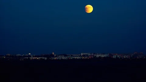 Partial Eclipsed Moon Rising Stock Footage 112452027