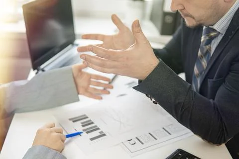 Partial focus. hands of two businessmen who argue. high quality Stock Photos