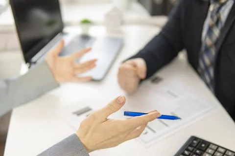 Partial focus. hands of two businessmen who argue. high quality Stock Photos