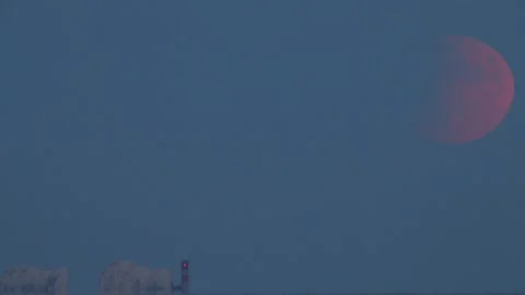 Partial lunar eclipse in Dorset on 50th anniversary of moon landing Stock Footage 148575253