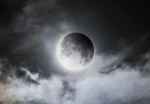 Partial Lunar Eclipse Hidden Behind Moving Clouds Stock Photos