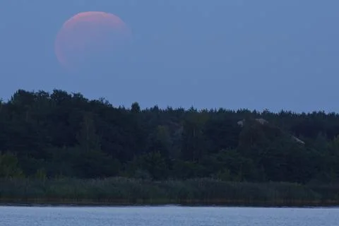 Partial lunar eclipse Middle Elbe Biosphere Reserve Saxony Anhalt Germany Stock Photos