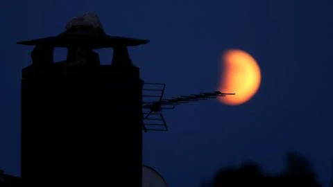 Partial lunar eclipse in Spain, Puebla De Sanabria - 16 Jul 2019 Stock Photos