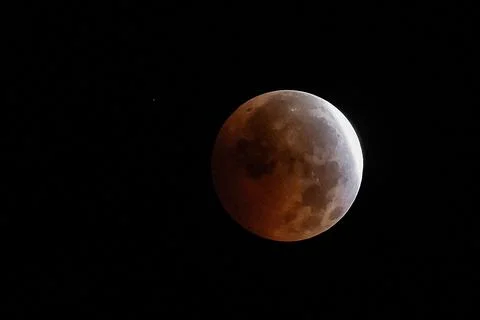 Partial lunar eclipse viewed in Seville, Mairena Del Aljarafe, Spain - 28 Aug 20 Stock Photos
