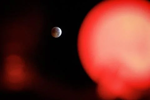 Partial lunar eclipse viewed in Seville, Mairena Del Aljarafe, Spain - 28 Aug 20 Stock Photos