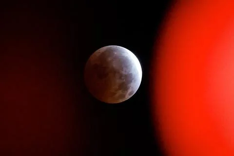 Partial lunar eclipse viewed in Seville, Mairena Del Aljarafe, Spain - 28 Aug 20 Stock Photos