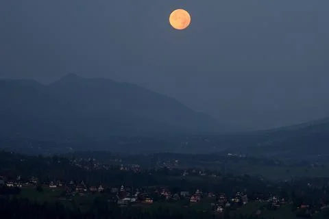 Partial lunar eclipse visible from Zgorzelisko Glade, Polana Zgorzelisko, Poland Stock Photos