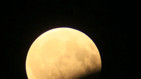 Partial moon eclipse in rise Stock Footage 149204400