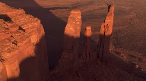 Partial orbit of Three Sisters to view of Mitchell Mesa in Monument Valley Stock Footage 59526004
