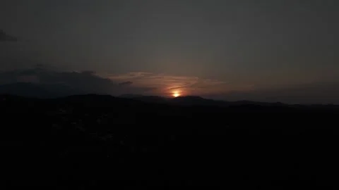 Partial Solar Eclipse Above Dark Mountain Horizon Stock Footage 344440359
