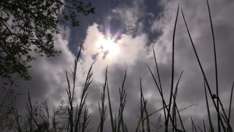 Partial solar eclipse amid cloudy skies across parts of UK Stock Footage 155438991