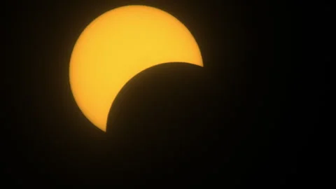 Partial Solar Eclipse Beginning to Form Stock Footage 272697290
