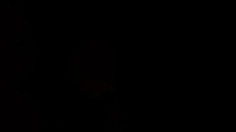 Partial solar eclipse being covered by clouds, reemerging, and then being Stock Footage 273272186