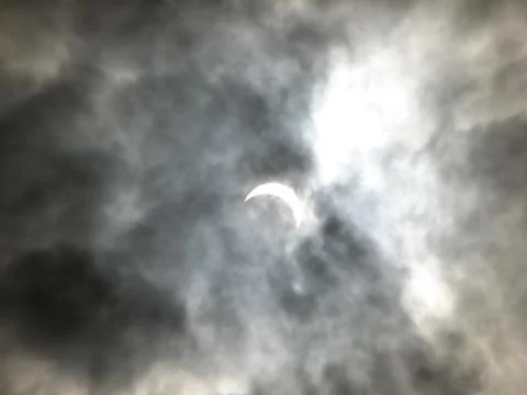 Partial solar eclipse in the clouds. ukraine. march 29, 2006. Stock Photos