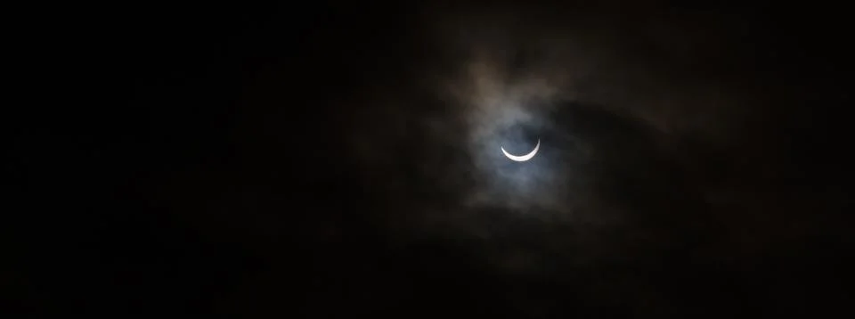 Partial Solar Eclipse on a Cloudy Day in Kristiansand Norway Fotos Stock