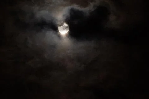 Partial solar eclipse with cloudy sky Fotos Stock