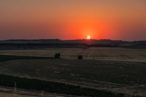 Partial solar eclipse creating a crescent sun over a rural landscape in Spain Stock Photos