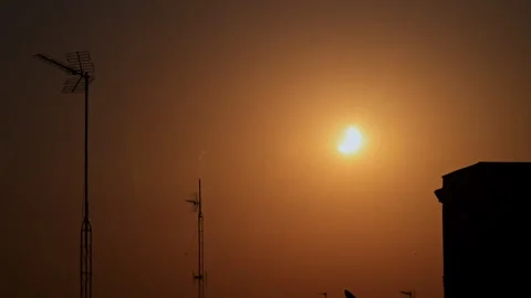 Partial Solar Eclipse Crescent Central Madrid Spain Rooftop TV Antennas Haze Stock Footage 347672142