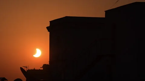 Partial Solar Eclipse Crescent Madrid Dark Building Silhouette Orange Dusk Stock Footage 347673157