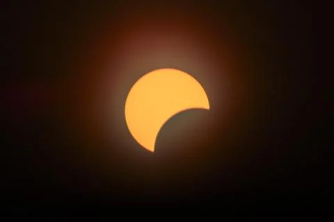 Partial Solar Eclipse Crescents in Fiery Sky, Spiceland Perspective Stock Photos
