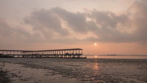 Partial solar eclipse at fisherman harbor with ray formation at Jelutong Penang, Stock Footage 86243346
