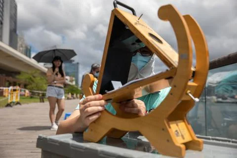Partial solar eclipse in Hong Kong, China - 21 Jun 2020 Stock Photos