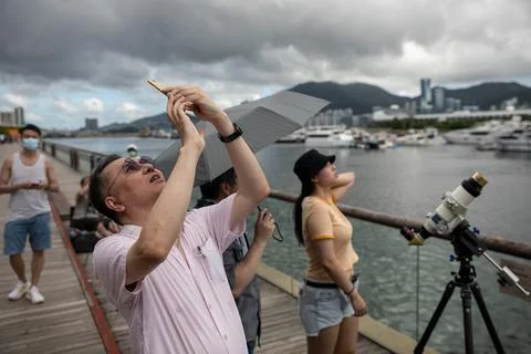 Partial solar eclipse in Hong Kong, China - 21 Jun 2020 Stock Photos