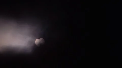 Partial Solar Eclipse of June 10 2021 Visible Through Clouds Stock Footage 340968229