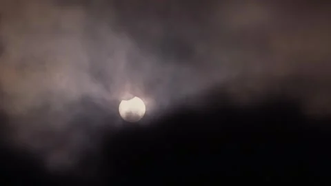 Partial Solar Eclipse of June 10 2021 Visible Through Clouds Stock Footage 340968280