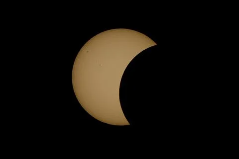 Partial Solar Eclipse with the Moon Crossing the Sun Stock Photos