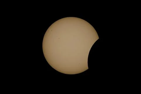 Partial Solar Eclipse with the Moon Crossing the Sun Stock Photos