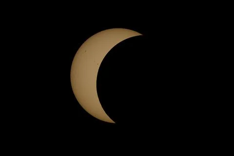 Partial Solar Eclipse with the Moon Crossing the Sun Stock Photos
