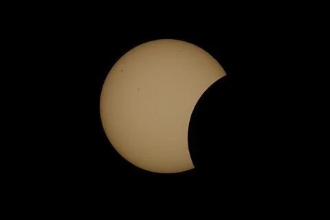 Partial Solar Eclipse with the Moon Crossing the Sun Stock Photos