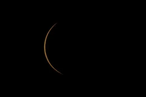 Partial Solar Eclipse with the Moon Crossing the Sun Stock Photos