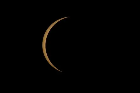 Partial Solar Eclipse with the Moon Crossing the Sun Stock Photos