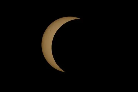 Partial Solar Eclipse with the Moon Crossing the Sun Stock Photos