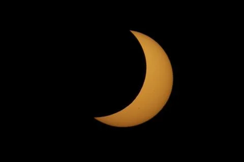 Partial Solar Eclipse with the Moon Crossing the Sun Stock Photos