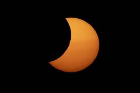 Partial Solar Eclipse with the Moon Crossing the Sun Stock Photos