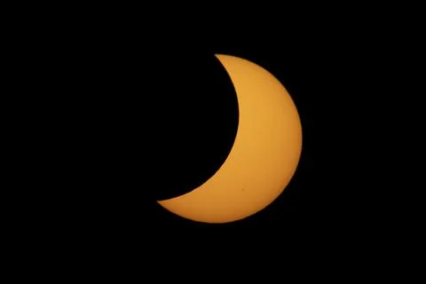 Partial Solar Eclipse with the Moon Crossing the Sun Stock Photos