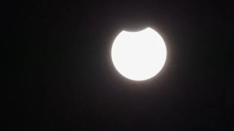 Partial solar eclipse with moon before sun Stock Footage 220727703