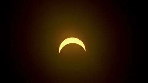 Partial solar eclipse by moon time lapse closeup 動画素材 271368317